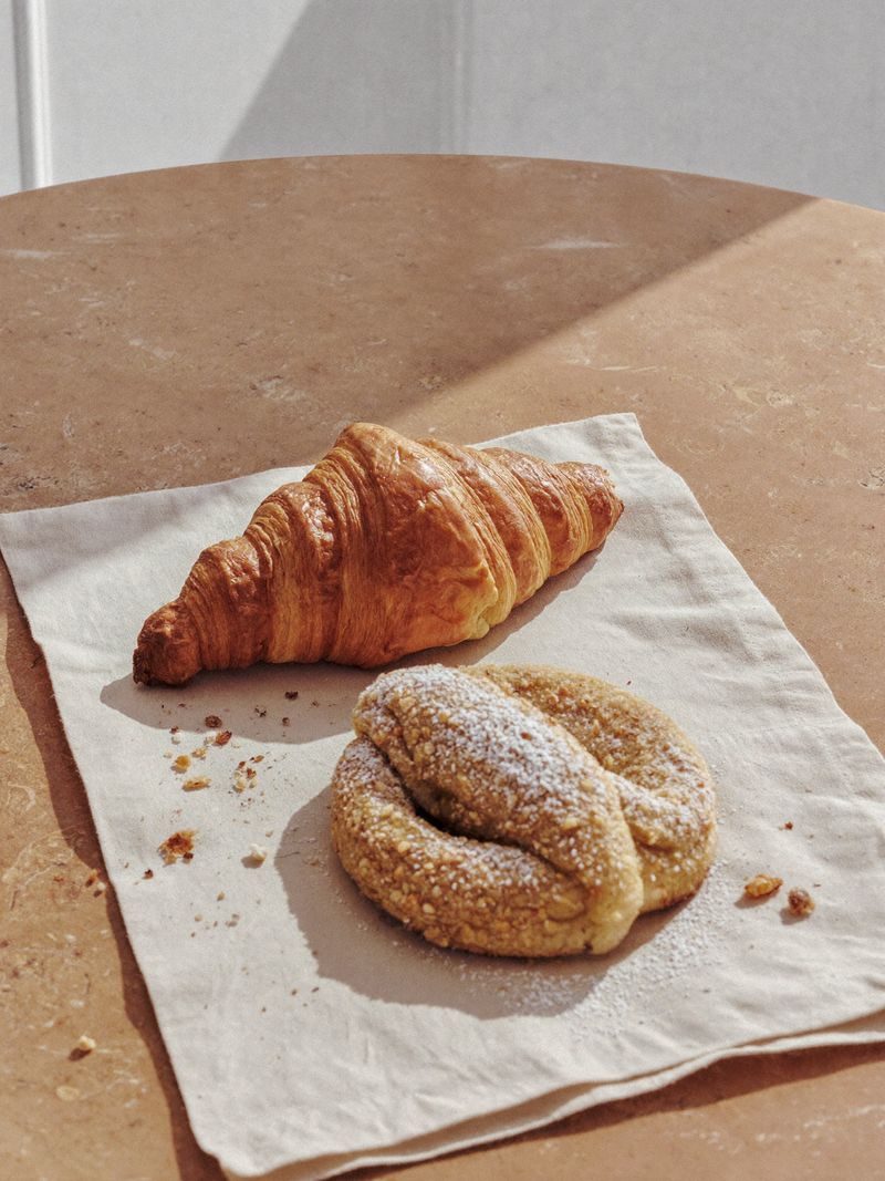 Croissant and pastry on a linen napkin